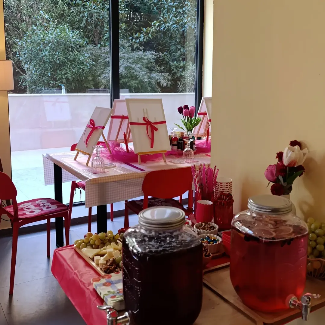 the café by the big window, with drink jars and tables set for a workshop